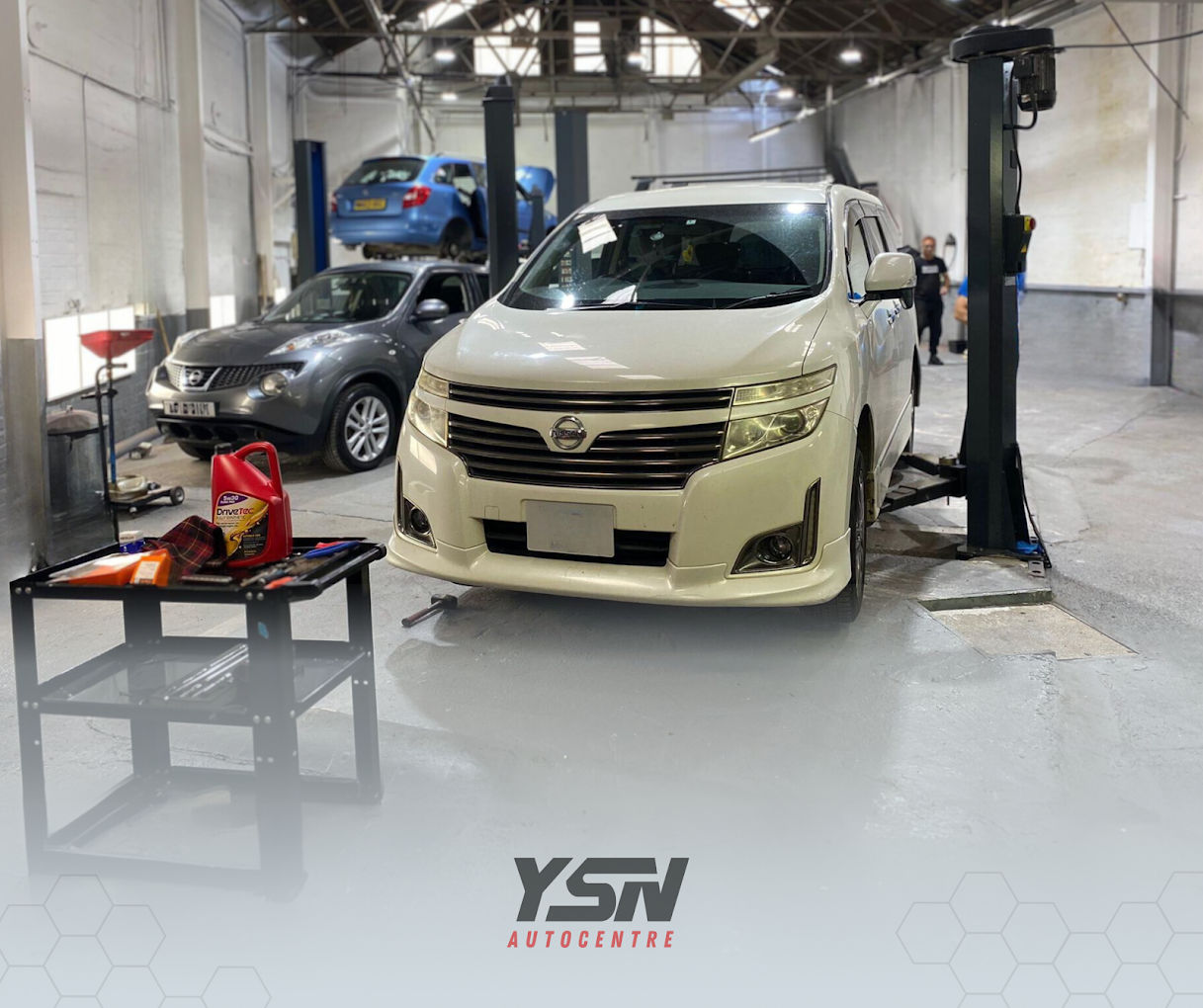 YSN Autocentre workshop in Smethwick with cars on ramps